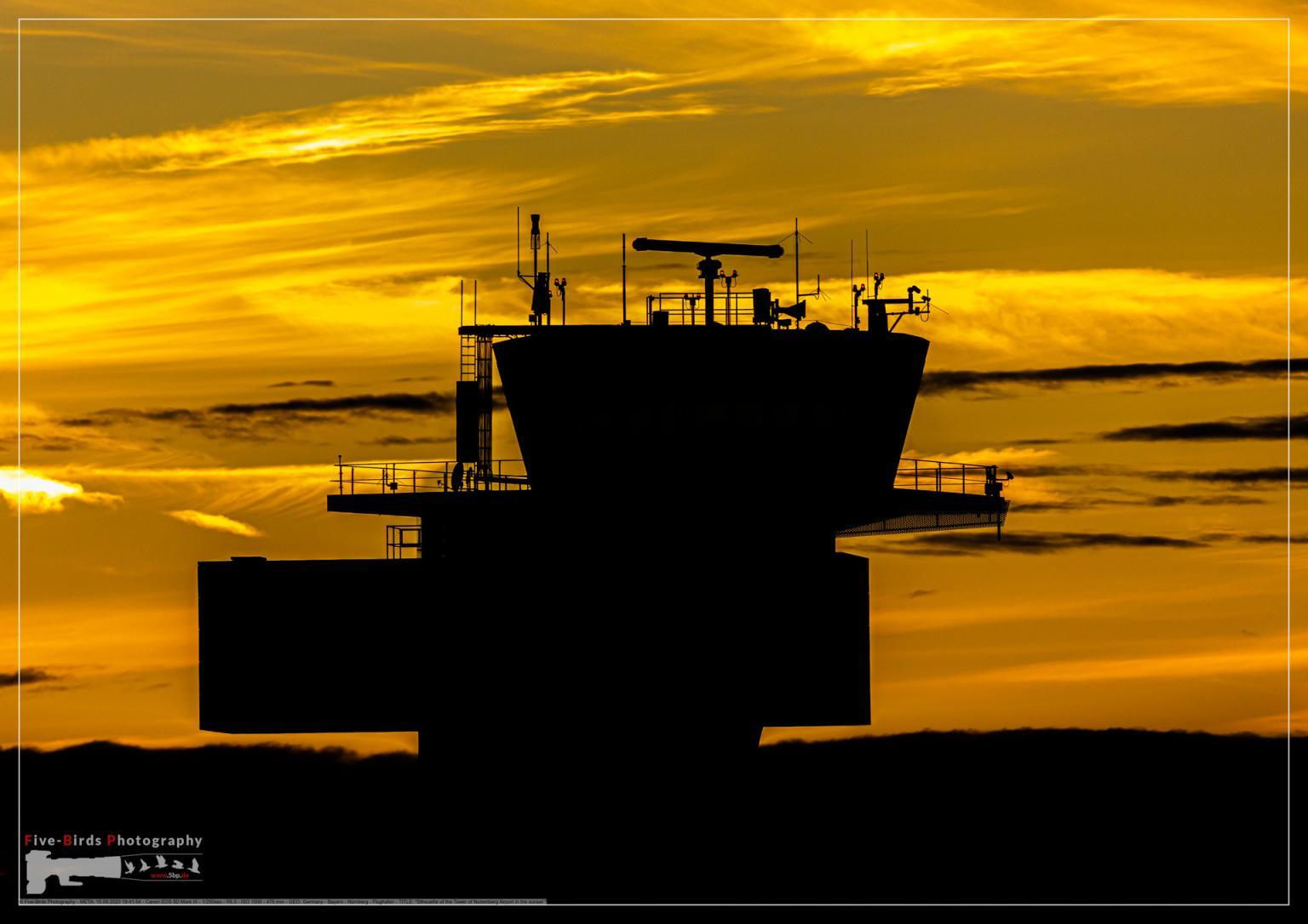 Silhouette of the Tower of Nuremberg Airport in the sunset 